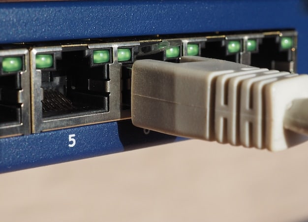 A close-up of a Gigabit Ethernet port on a computer, with the cable plugged in, highlighting the physical connection required for the upgrade.