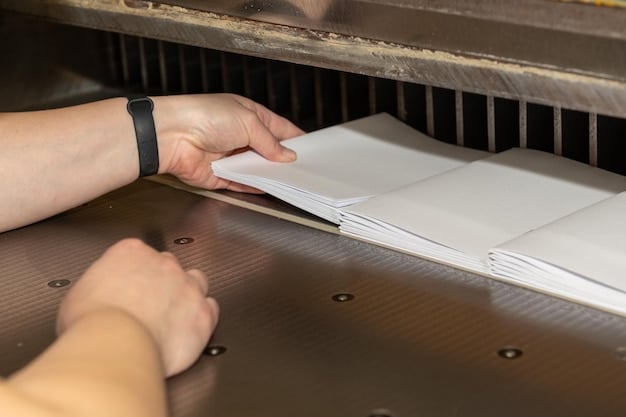 A close-up view of a hand removing a jammed piece of paper from a printer. The focus is on the paper and the printer's internal mechanisms.