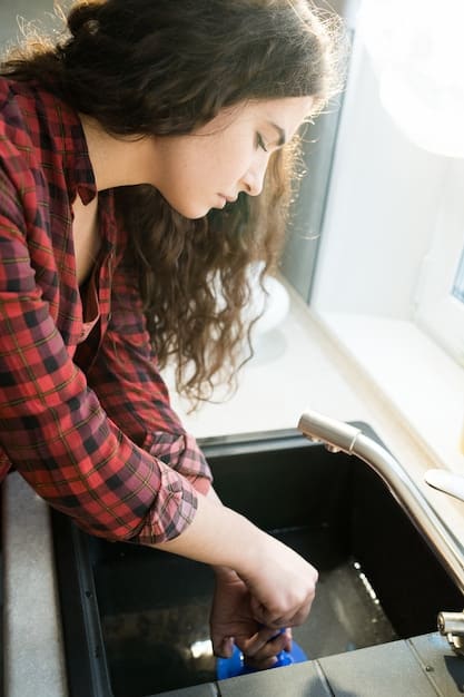 An image showing a person replacing an ink cartridge in a printer, focusing on proper alignment and insertion technique.