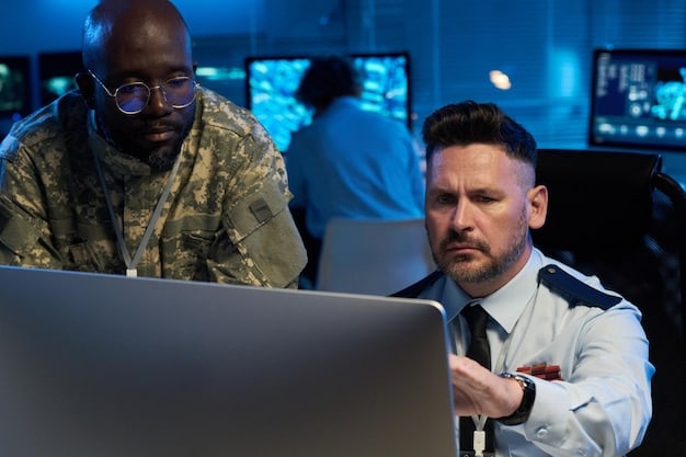 A team of IT professionals collaborating in a security operations center, responding to a ransomware alert. The scene emphasizes teamwork, quick decision-making, and the use of advanced security tools during a crisis.