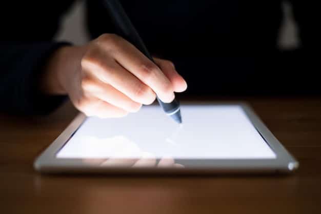 A close-up of a digital SLA document on a tablet screen, highlighting sections about uptime guarantees and service credits. A pen is resting on the tablet, implying careful review.